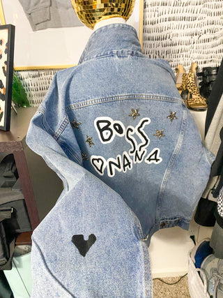 denim jacket with handwritten "BOSS NANA" on the back with a hear ton the sleeve 